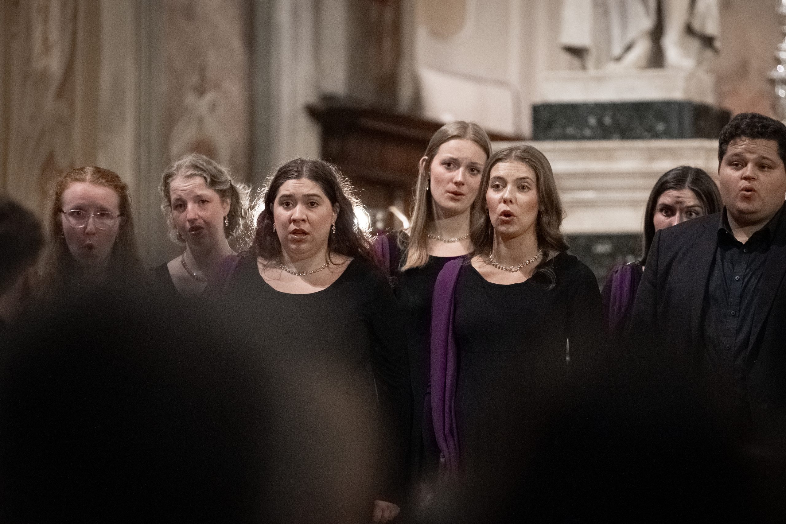 Close-up photo of BYU Singers performing inside a cathedral on their Europe tour
